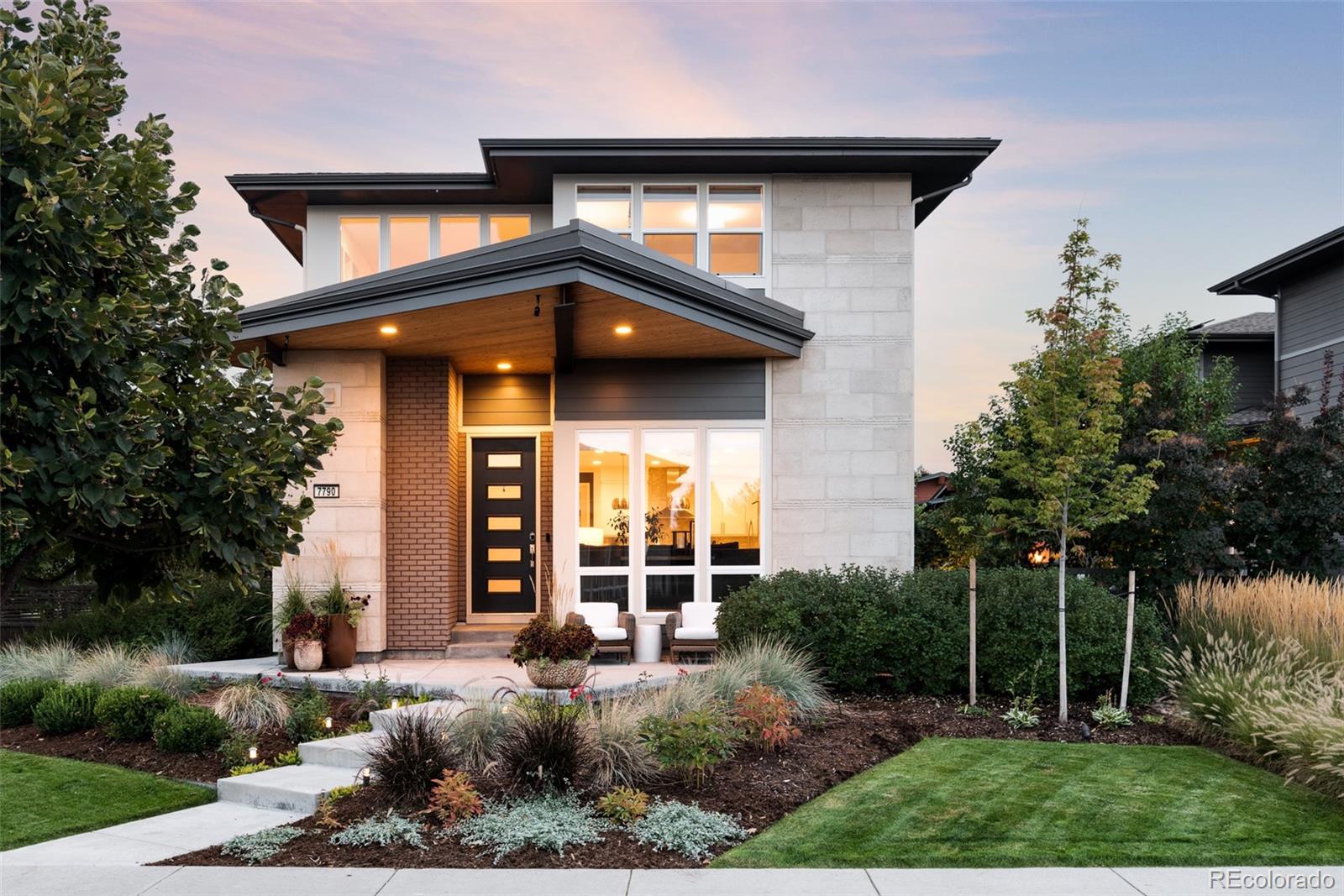 7790 East 32nd Avenue Denver, CO 80238 - Photo 2 of 40 a front view of a house with garden