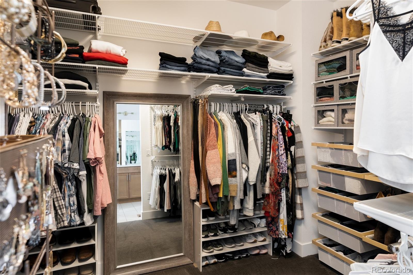 7790 East 32nd Avenue Denver, CO 80238 - Photo 21 of 40 a view of walk in closet with clothes and shoes