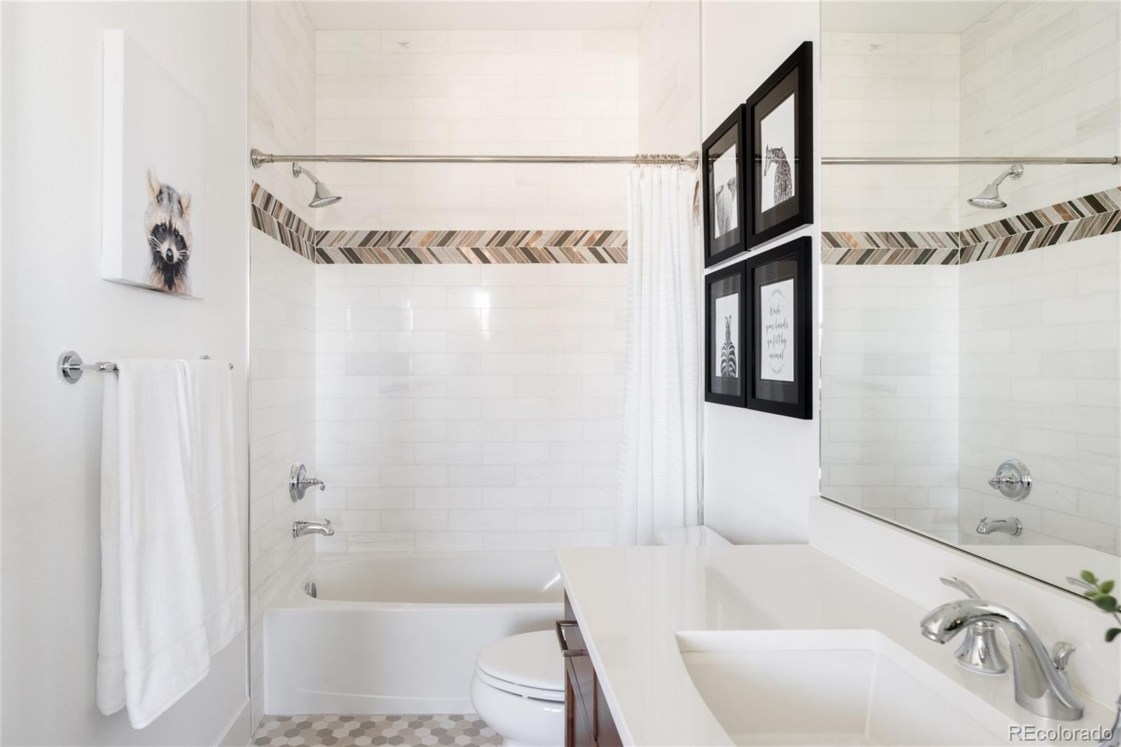 7790 East 32nd Avenue Denver, CO 80238 - Photo 23 of 40 a bathroom with a shower and a bathtub