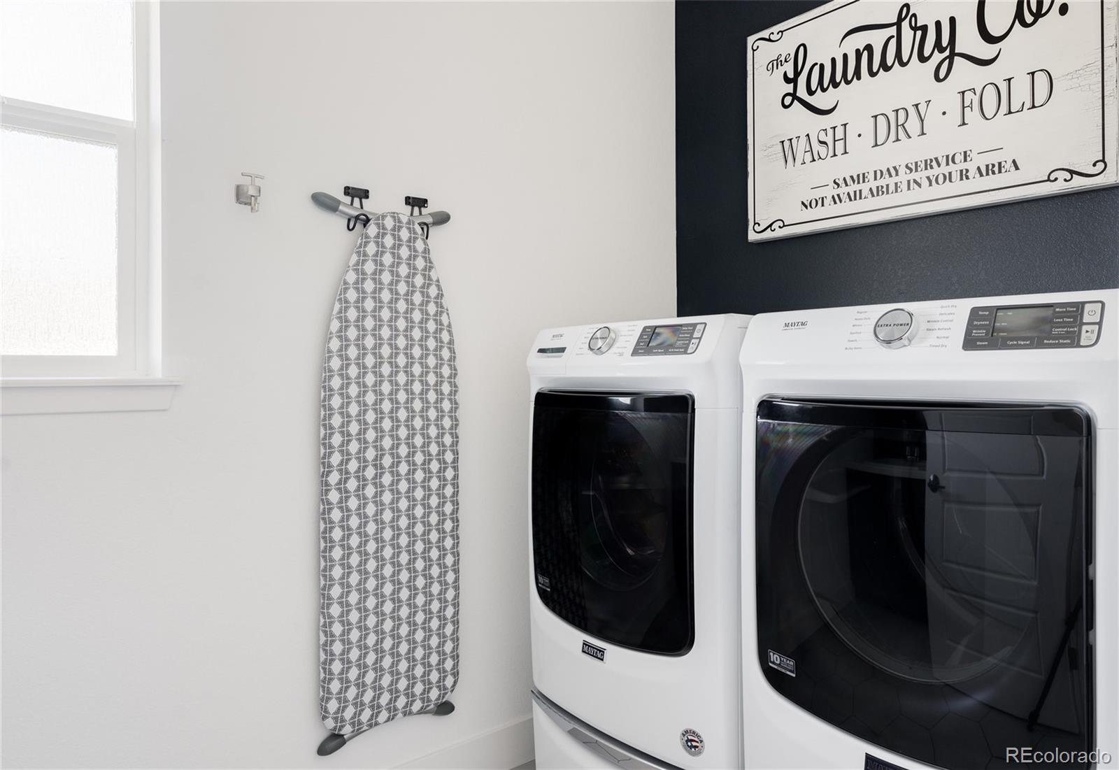 7790 East 32nd Avenue Denver, CO 80238 - Photo 25 of 40 a close up view of a sink and washer dryer