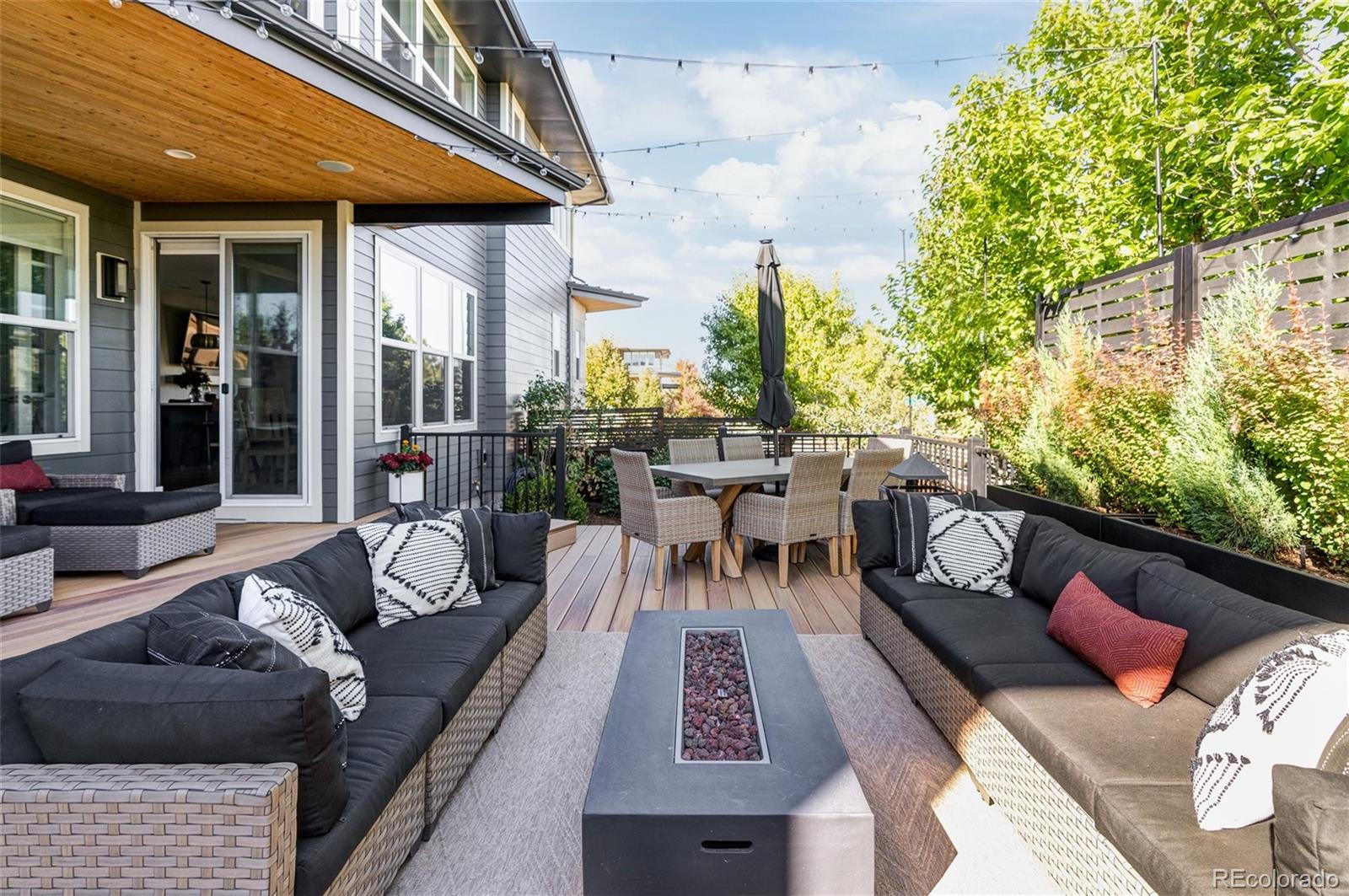 7790 East 32nd Avenue Denver, CO 80238 - Photo 32 of 40 a view of a patio with couches table and chairs and potted plants