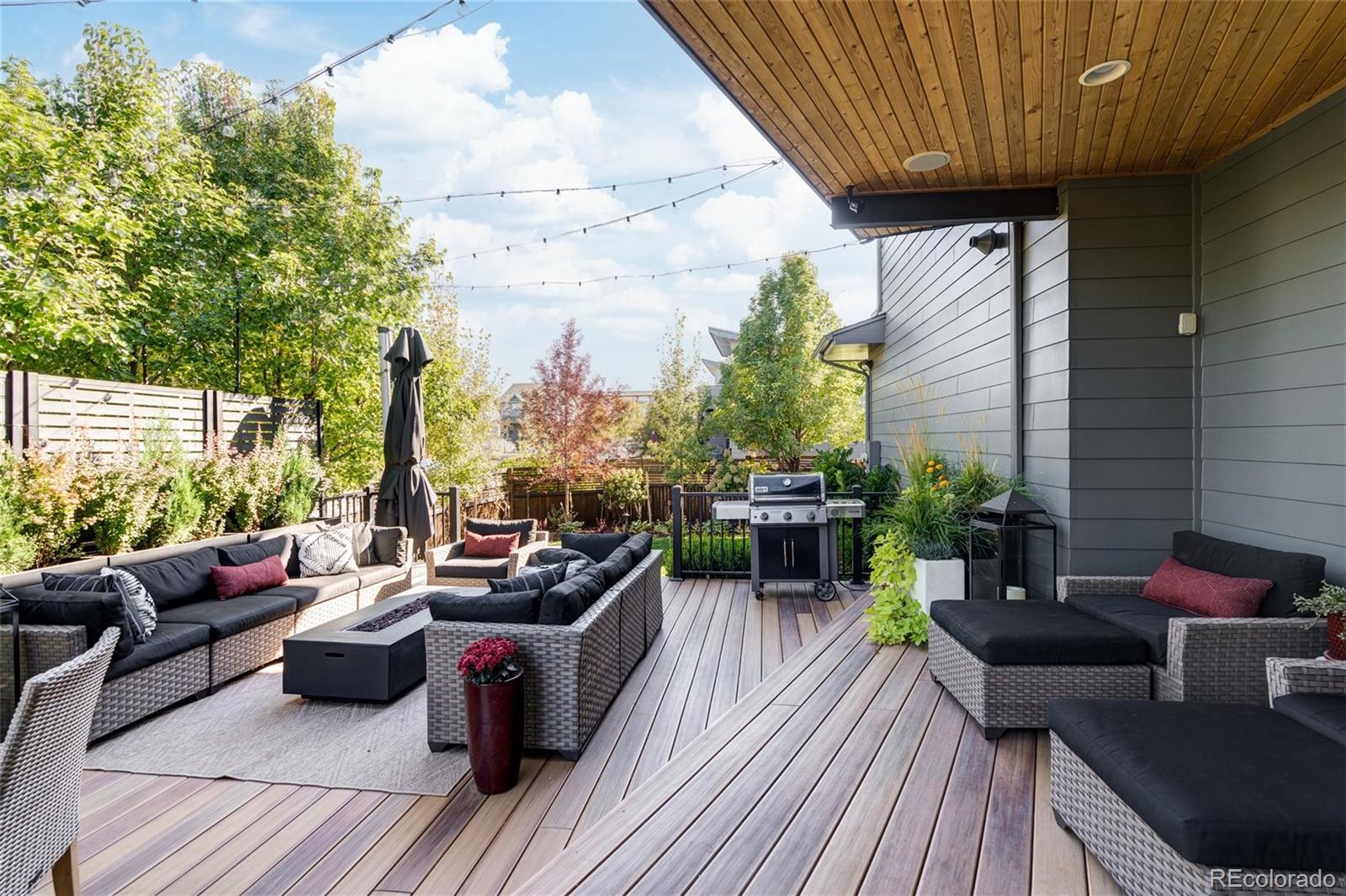 7790 East 32nd Avenue Denver, CO 80238 - Photo 33 of 40 a patio with patio couch and wooden floor