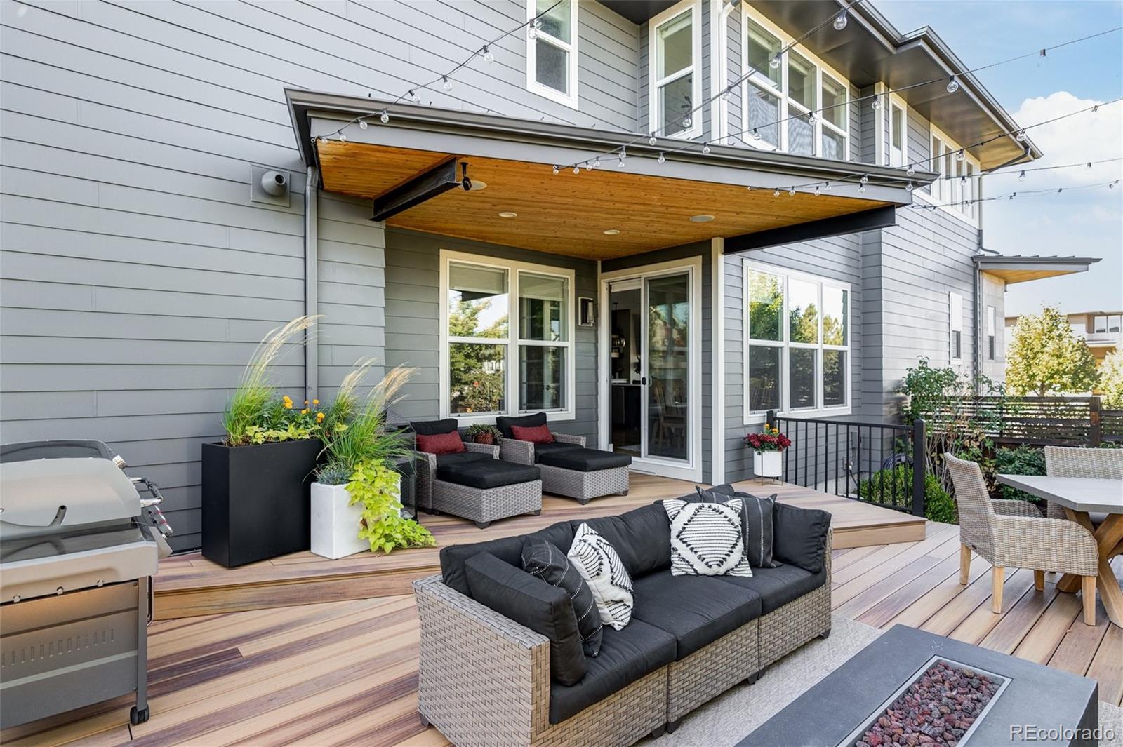 7790 East 32nd Avenue Denver, CO 80238 - Photo 34 of 40 a view of a patio with couches table and chairs and potted plants