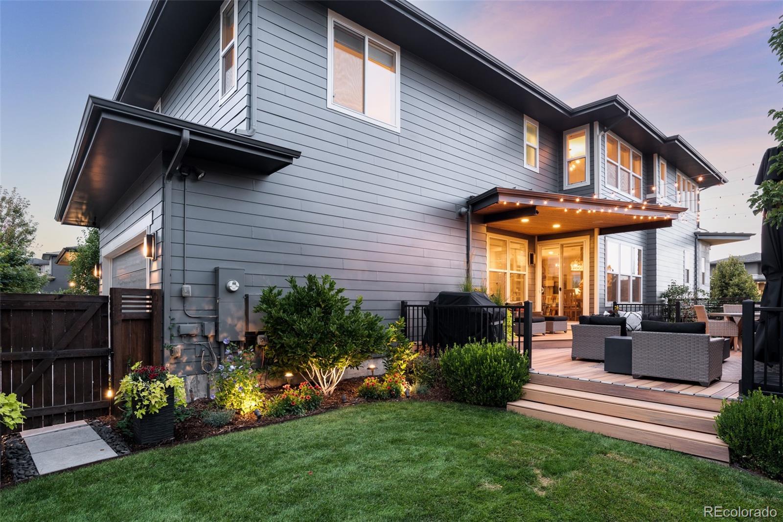 7790 East 32nd Avenue Denver, CO 80238 - Photo 39 of 40 a view of a house with a yard and furniture