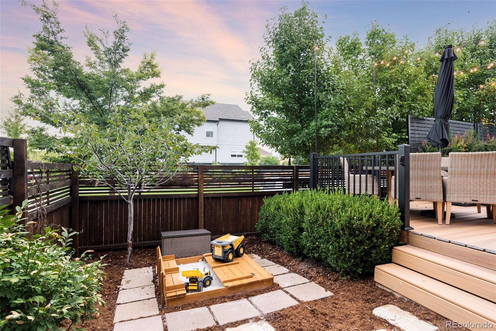 7790 East 32nd Avenue Denver, CO 80238 - Photo 40 of 40 a view of a chair and tables in the back yard of the house