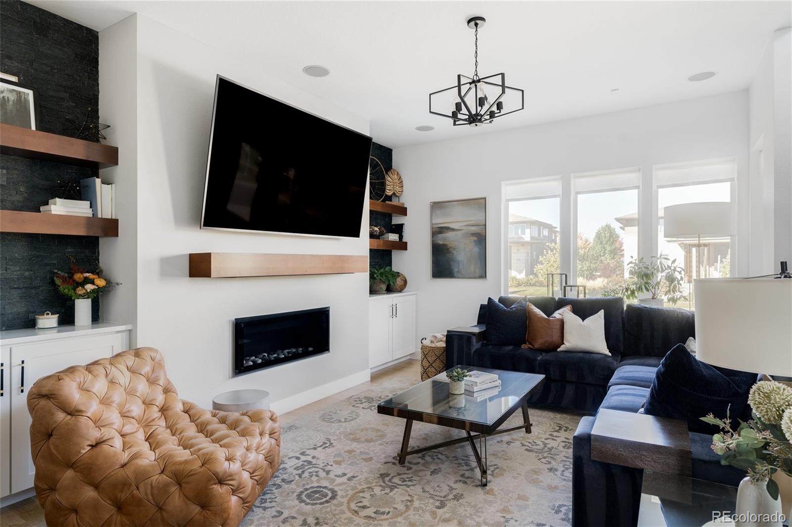 7790 East 32nd Avenue Denver, CO 80238 - Photo 4 of 40 a living room with furniture fireplace and flat screen tv