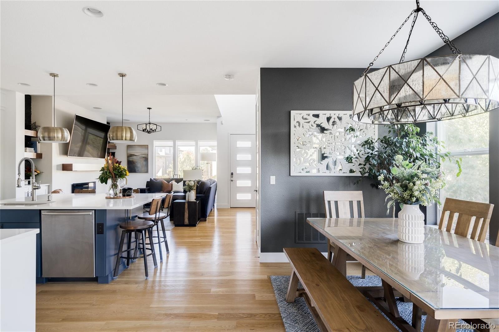 7790 East 32nd Avenue Denver, CO 80238 - Photo 8 of 40 a view of a dining room with furniture and wooden floor