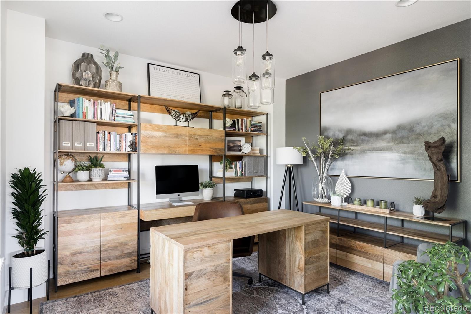 7790 East 32nd Avenue Denver, CO 80238 - Photo 10 of 40 a kitchen with stainless steel appliances a stove and a living room