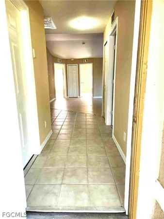 a view of hallway with windows