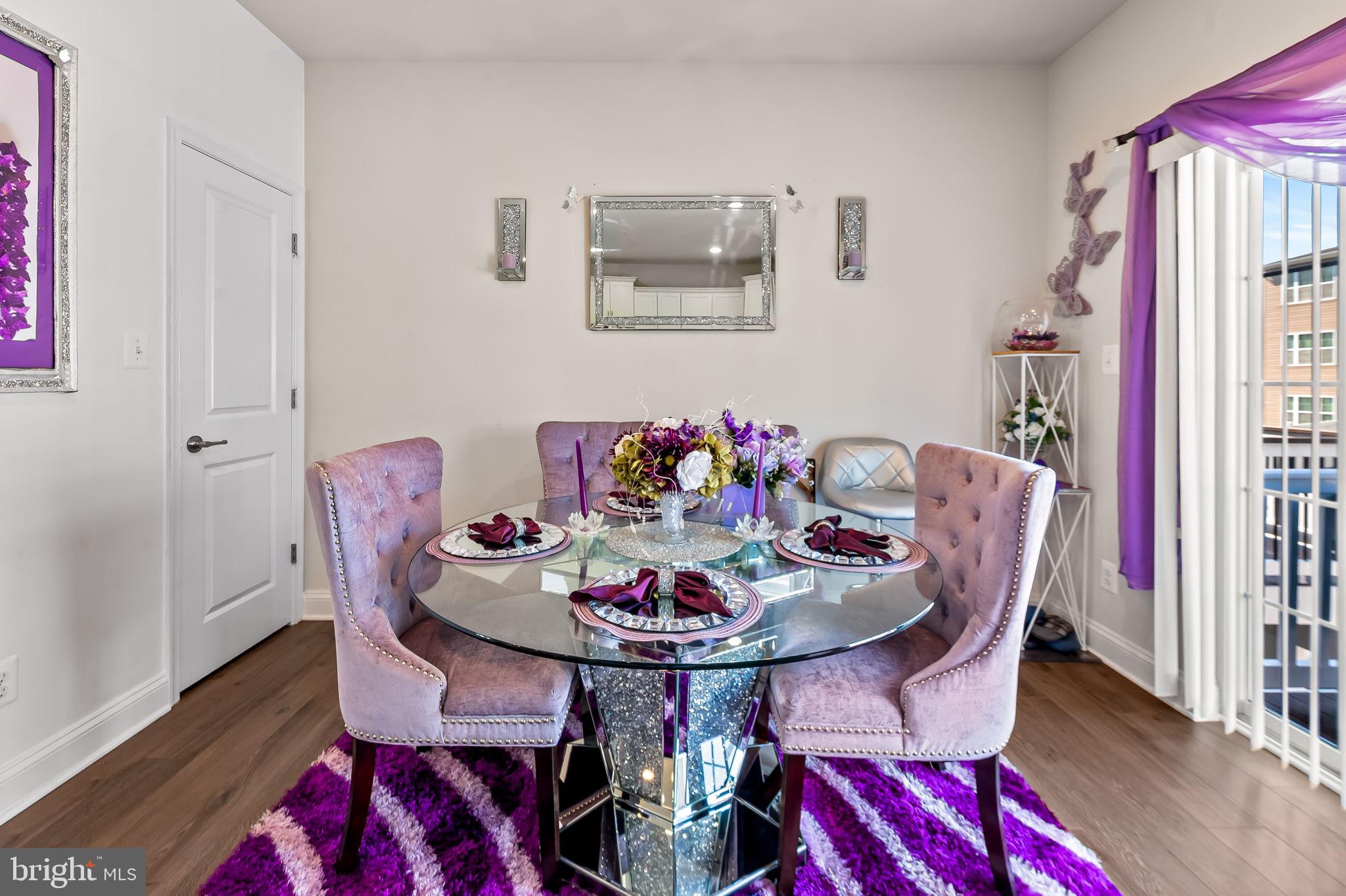 1309 Spindrift Road Aberdeen, MD 21001 - Photo 11 of 35 a view of a dining room with furniture and wooden floor