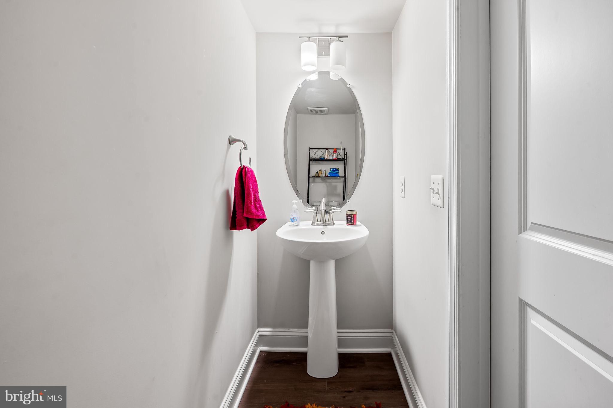 1309 Spindrift Road Aberdeen, MD 21001 - Photo 12 of 35 a bathroom with a sink and a mirror