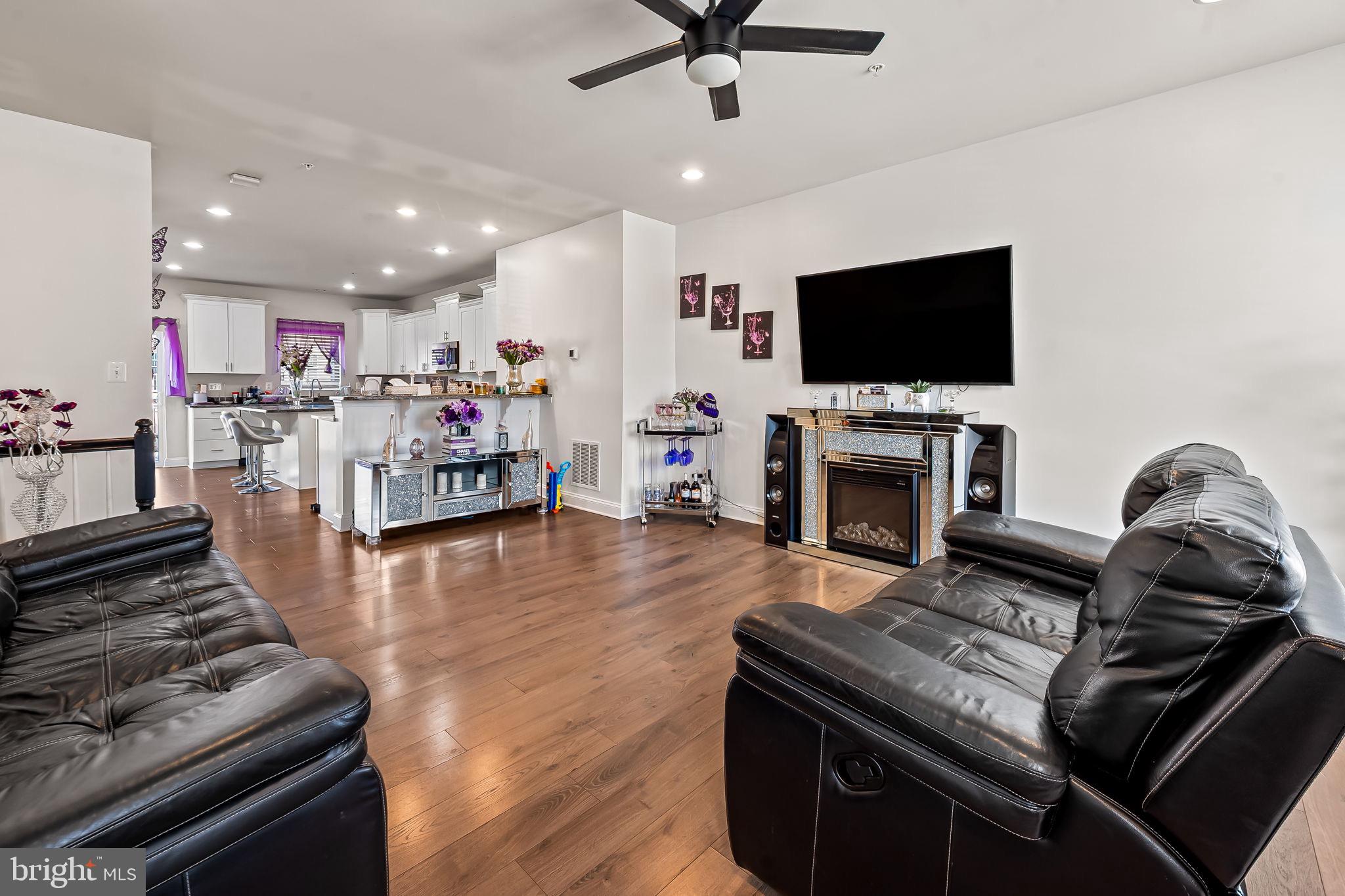 1309 Spindrift Road Aberdeen, MD 21001 - Photo 14 of 35 a living room with furniture and a flat screen tv
