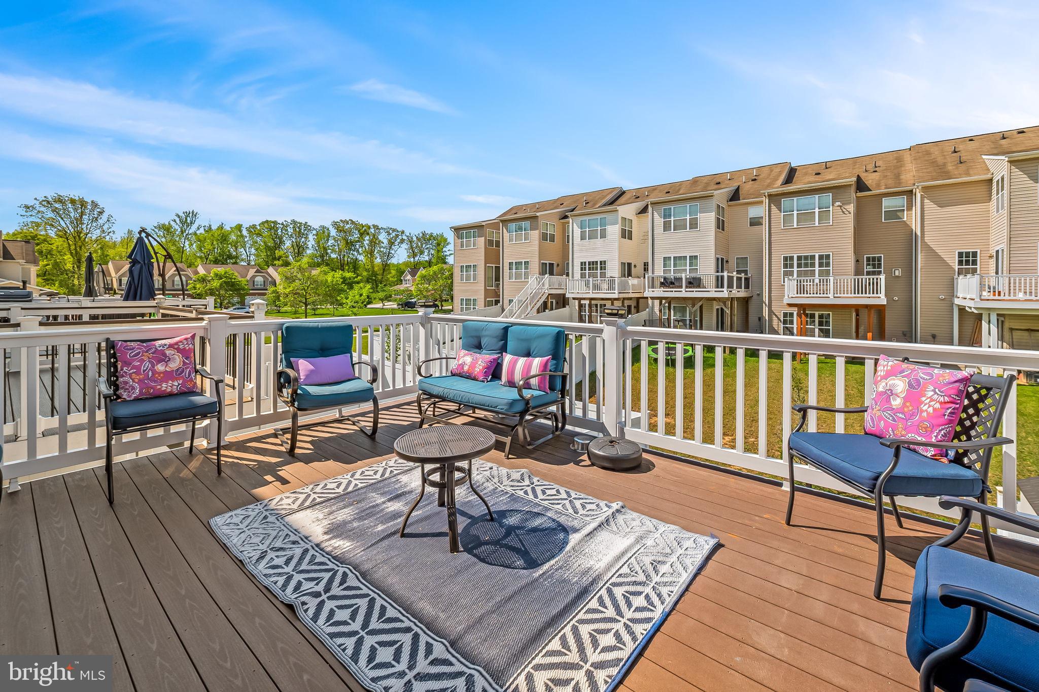1309 Spindrift Road Aberdeen, MD 21001 - Photo 17 of 35 a living room with furniture a rug and a floor to ceiling window