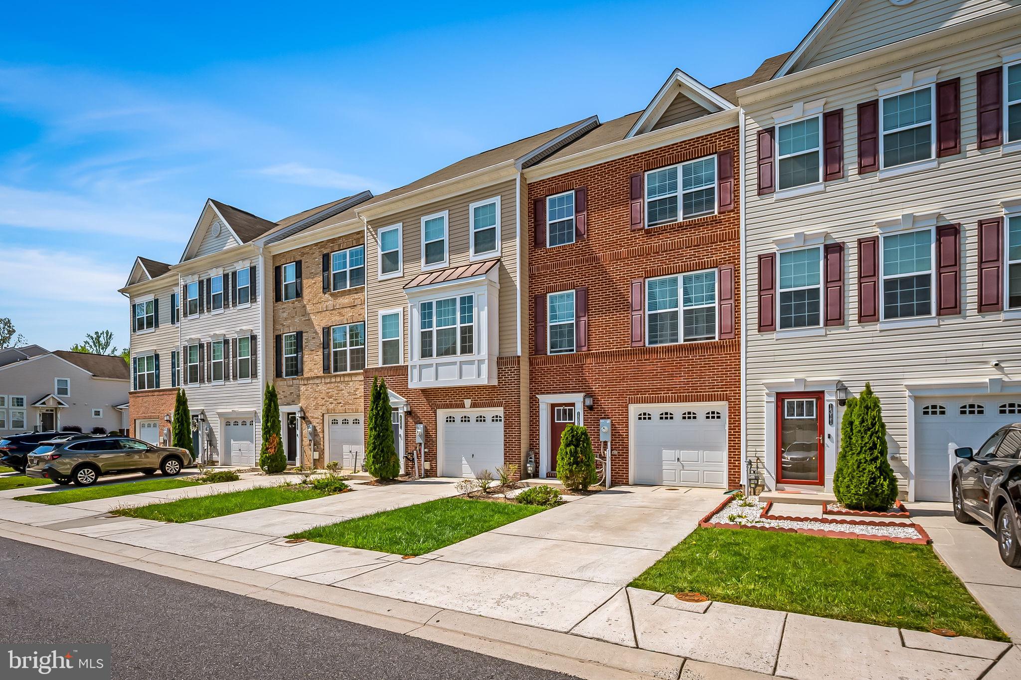 1309 Spindrift Road Aberdeen, MD 21001 - Photo 2 of 35 a front view of a building with a yard