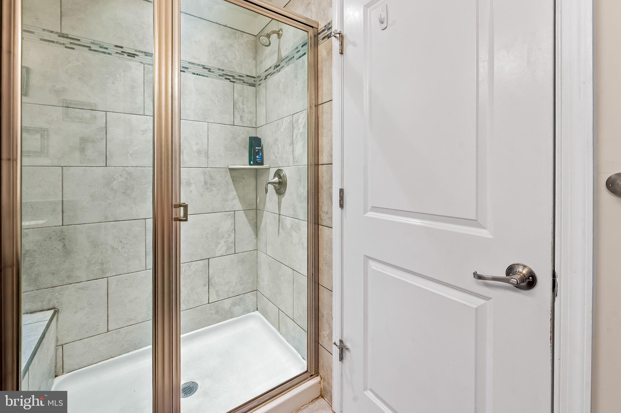 1309 Spindrift Road Aberdeen, MD 21001 - Photo 25 of 35 a bathroom with a glass shower door