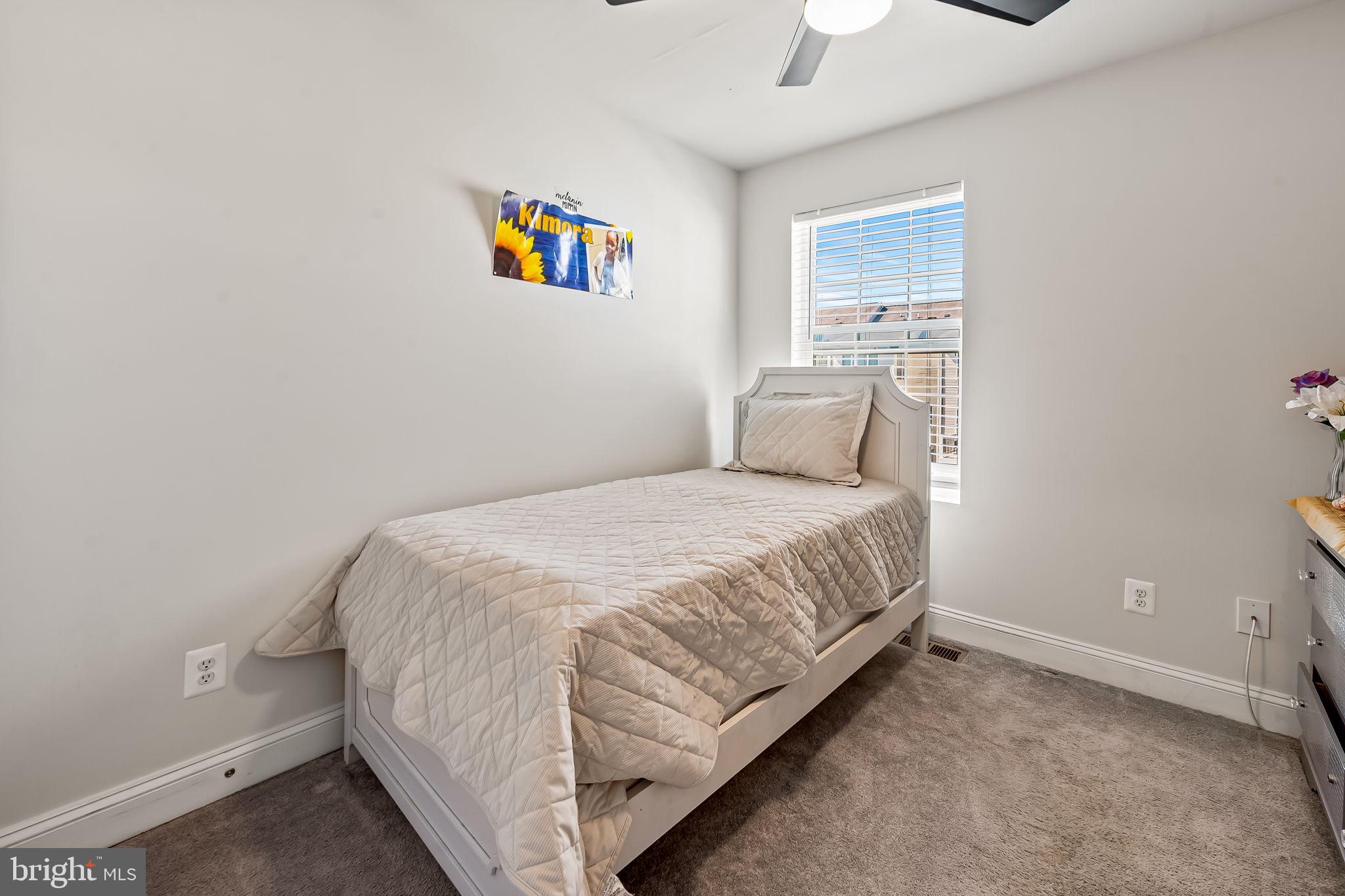 1309 Spindrift Road Aberdeen, MD 21001 - Photo 26 of 35 a bedroom with a bed and a painting on the wall