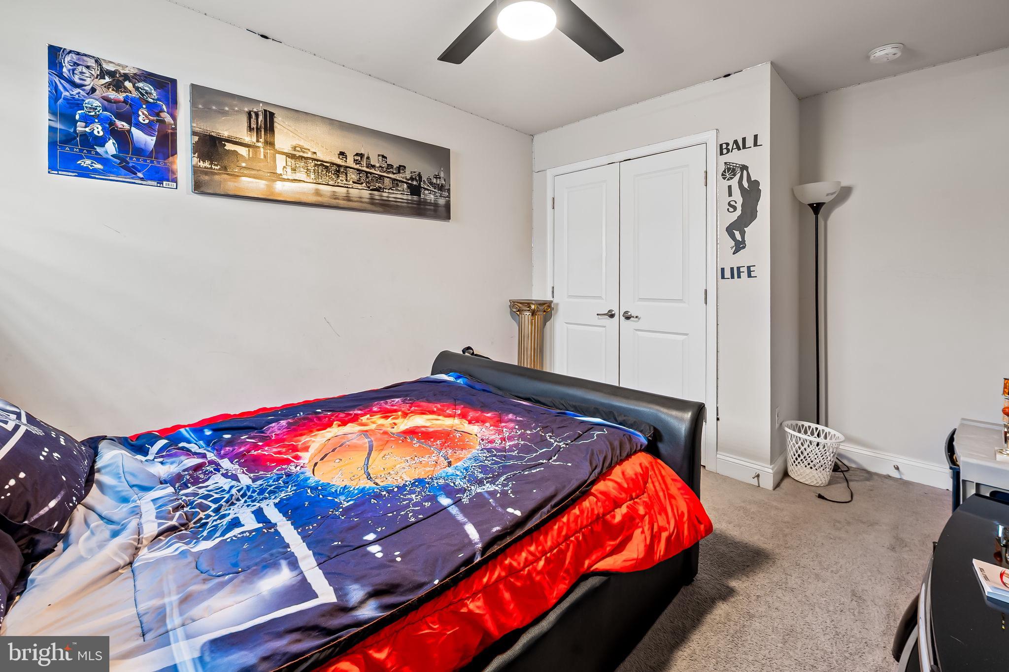 1309 Spindrift Road Aberdeen, MD 21001 - Photo 28 of 35 a bedroom with a bed and a chandelier