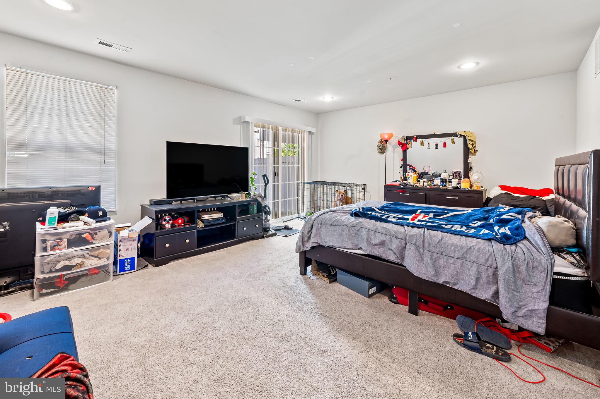 1309 Spindrift Road Aberdeen, MD 21001 - Photo 32 of 35 a bedroom with a bed and a flat screen tv