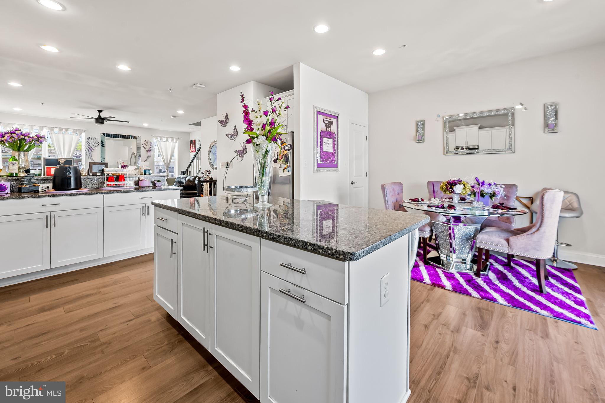 1309 Spindrift Road Aberdeen, MD 21001 - Photo 8 of 35 a very nice looking kitchen with kitchen island granite countertop wooden cabinets and a granite counter tops