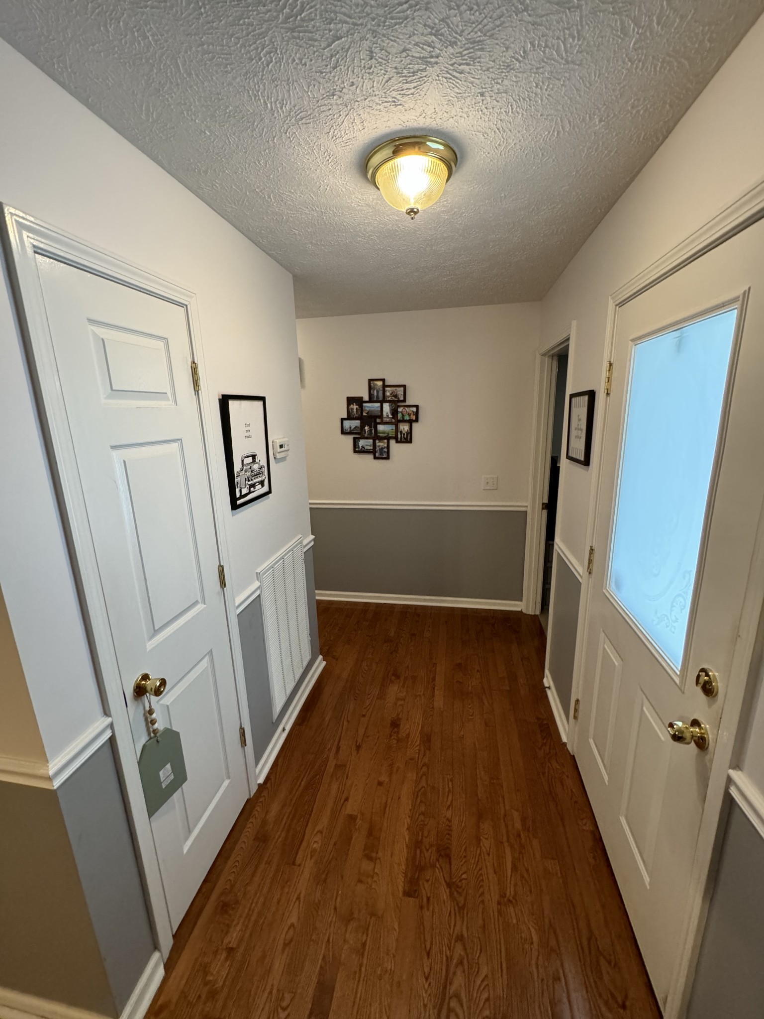 1724 Parker Road Manchester, TN 37355 - Photo 17 of 29 a view of a hallway with wooden floor and stairs