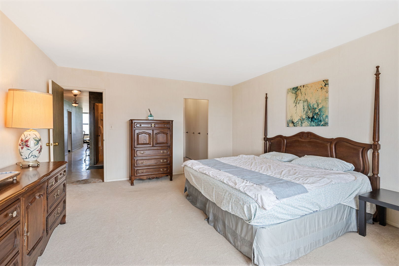 3150 North Lake Shore Drive, Unit 30C Chicago, IL 60657 - Photo 17 of 41 a spacious bedroom with a bed and cabinets