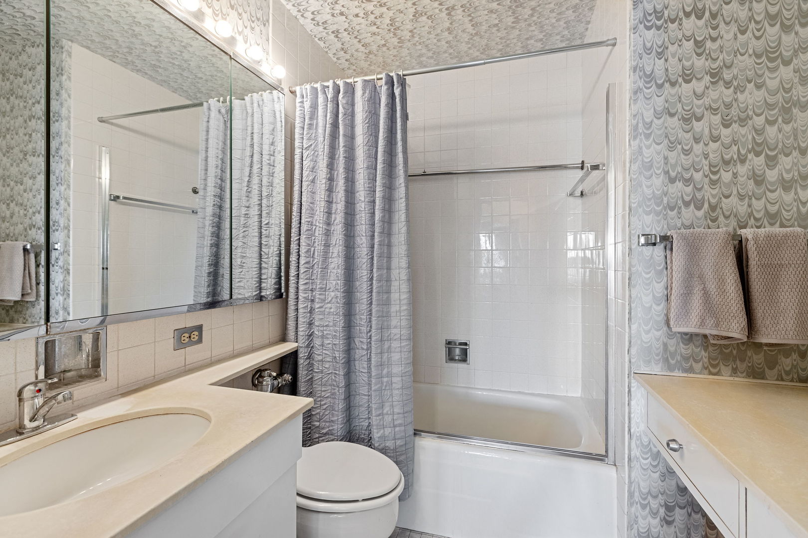 3150 North Lake Shore Drive, Unit 30C Chicago, IL 60657 - Photo 18 of 41 a bathroom with a sink a toilet and shower