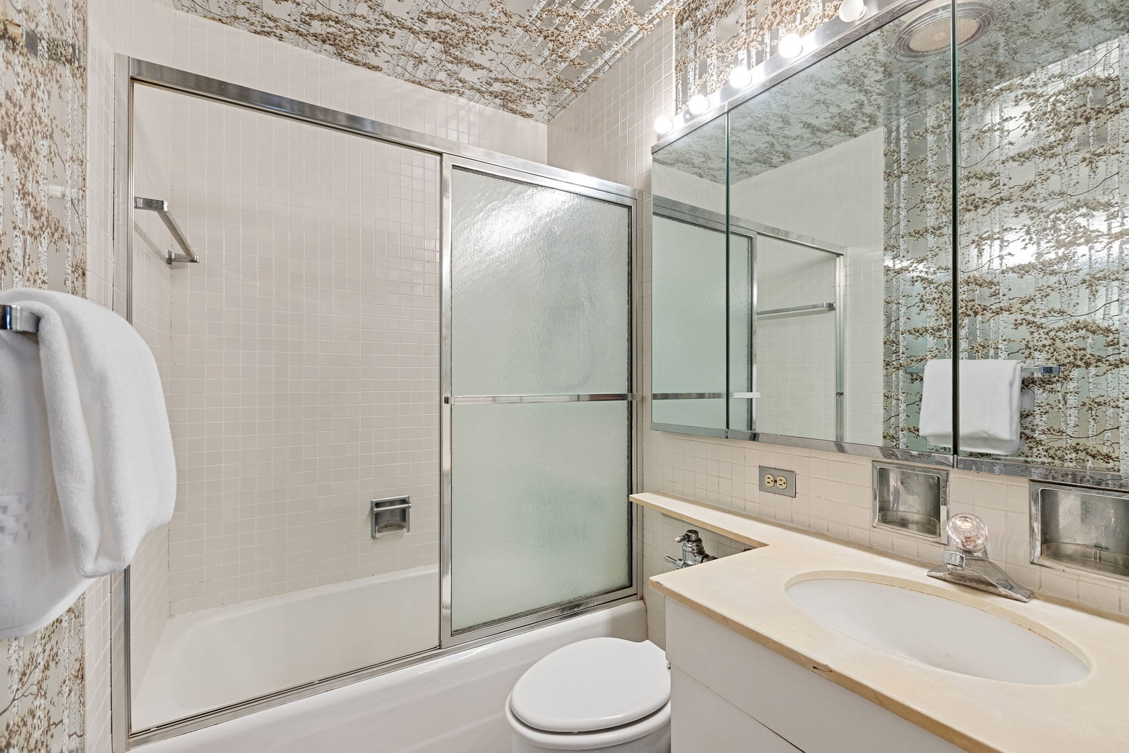 3150 North Lake Shore Drive, Unit 30C Chicago, IL 60657 - Photo 23 of 41 a bathroom with a sink toilet and shower
