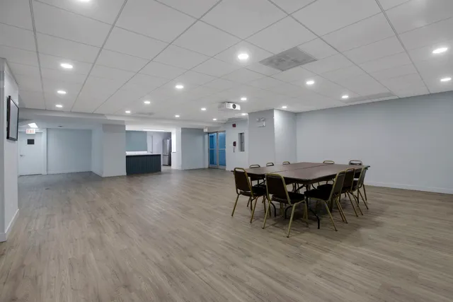 a view of a dining area with furniture and wooden floor