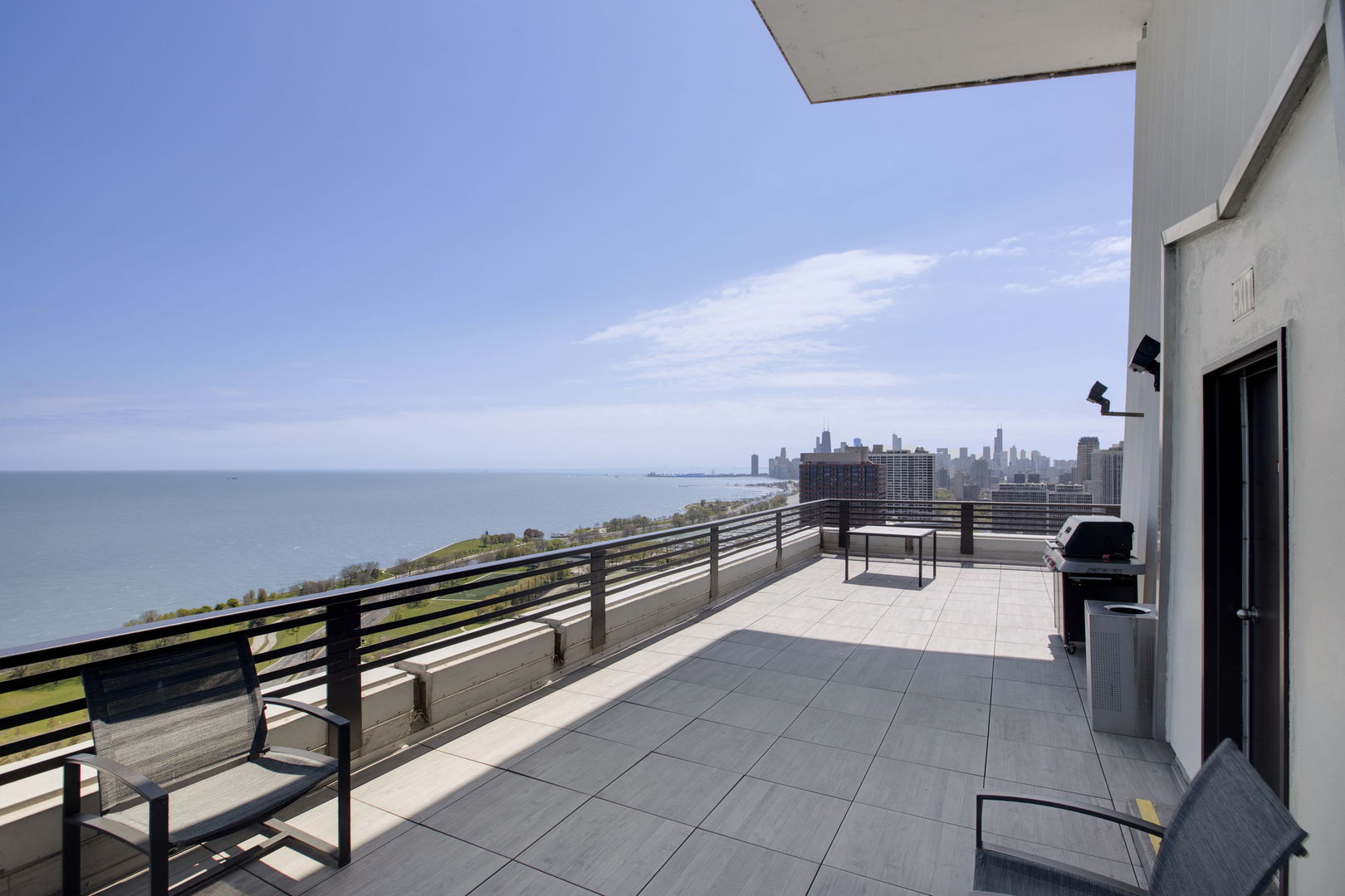 3150 North Lake Shore Drive, Unit 30C Chicago, IL 60657 - Photo 33 of 41 a terrace with outdoor seating and a potted plant