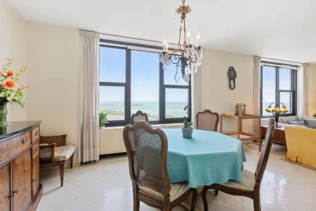 a view of a dining room with furniture window and outside view