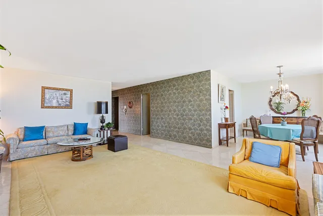 a living room with furniture a rug and a fireplace