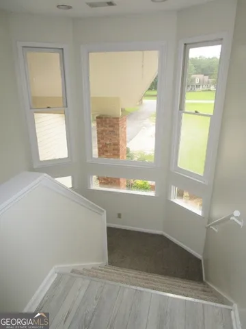 a bathroom with a bathtub and a window