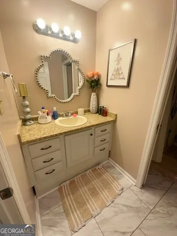 a bathroom with a double vanity sink mirror and