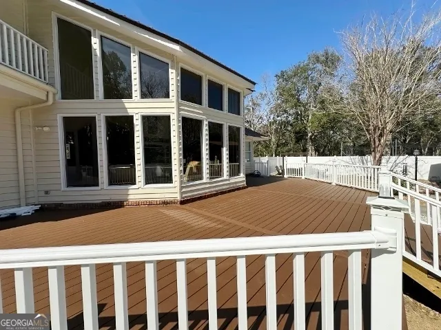 a view of a house with swimming pool and sitting area
