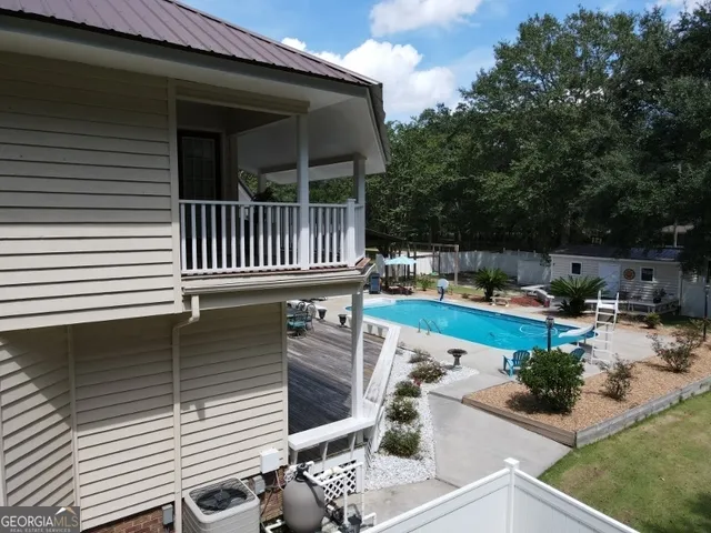 a view of a swimming pool with a patio