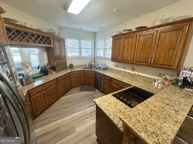 a kitchen with a sink stove and cabinets