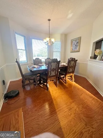 a workspace with furniture window and wooden floor