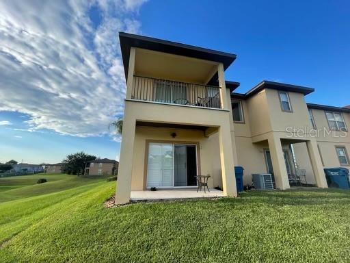 579 La Mirage Street Davenport, FL 33897 - Photo 1 of 23 a view of a house with a yard