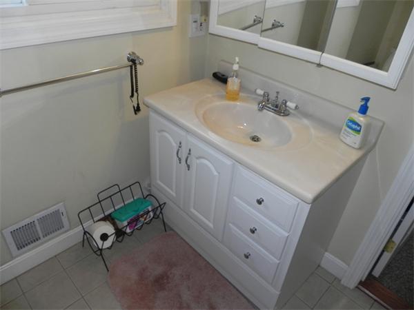 1349 Trapelo Road Waltham, MA 02451 - Photo 13 of 16 a bathroom with a sink and a mirror