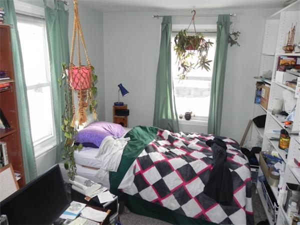 1349 Trapelo Road Waltham, MA 02451 - Photo 6 of 16 a bedroom with a bed and wooden floor