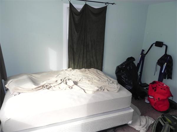 1349 Trapelo Road Waltham, MA 02451 - Photo 8 of 16 a bedroom with a bed and cabinets