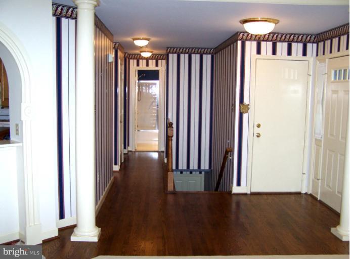 2373 Bear Den Road Frederick, MD 21701 - Photo 9 of 26 an empty room with wooden floor and a window