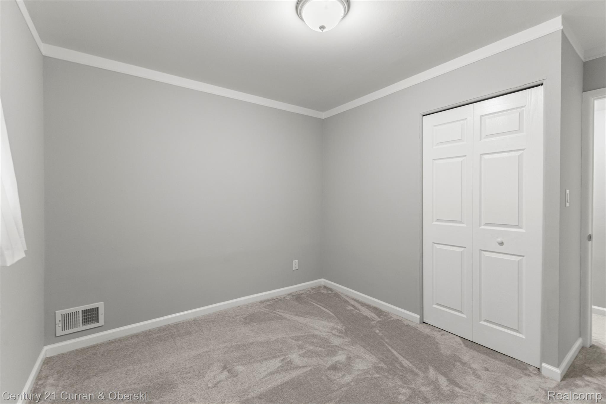7120 Jackson Street Taylor, MI 48180 - Photo 8 of 24 Unfurnished bedroom featuring carpet floors, ornamental molding, and a closet