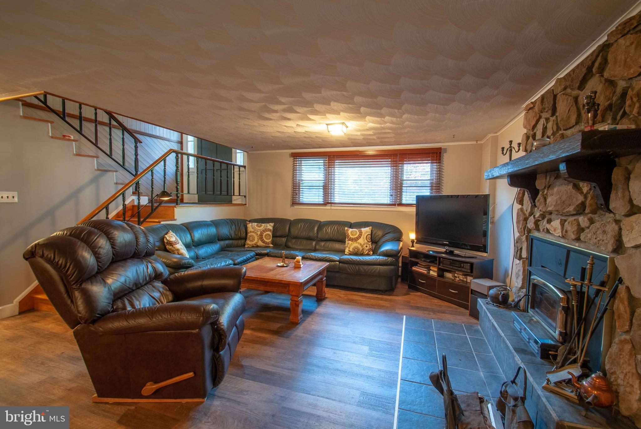 1491 Wakefield Road Edgewater, MD 21037 - Photo 23 of 37 Lower Level Family Room with Wood Stove