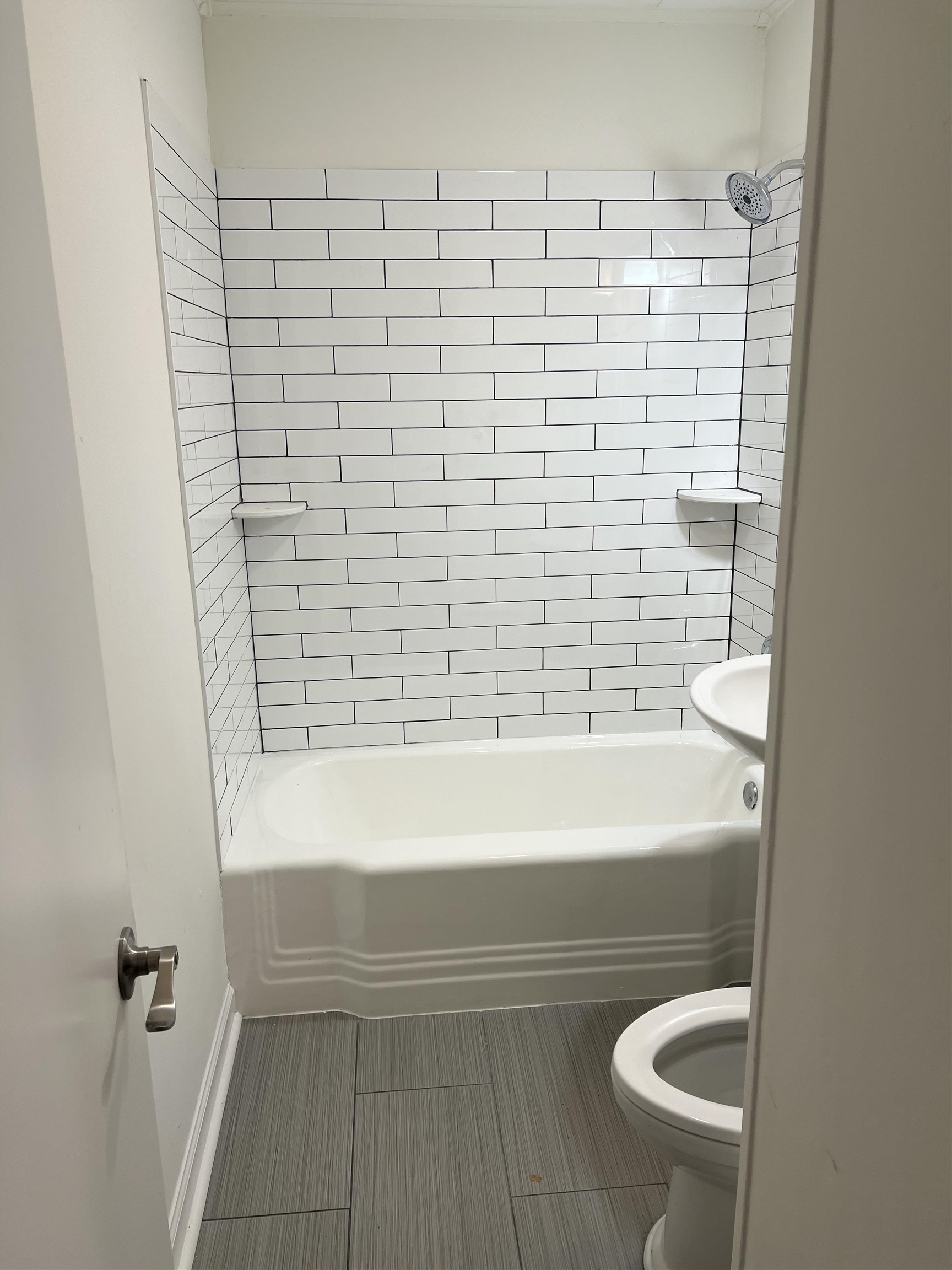 4865 Montgomery Road Millington, TN 38053 - Photo 6 of 7 Bathroom with tile patterned floors, tiled shower / bath combo, and toilet