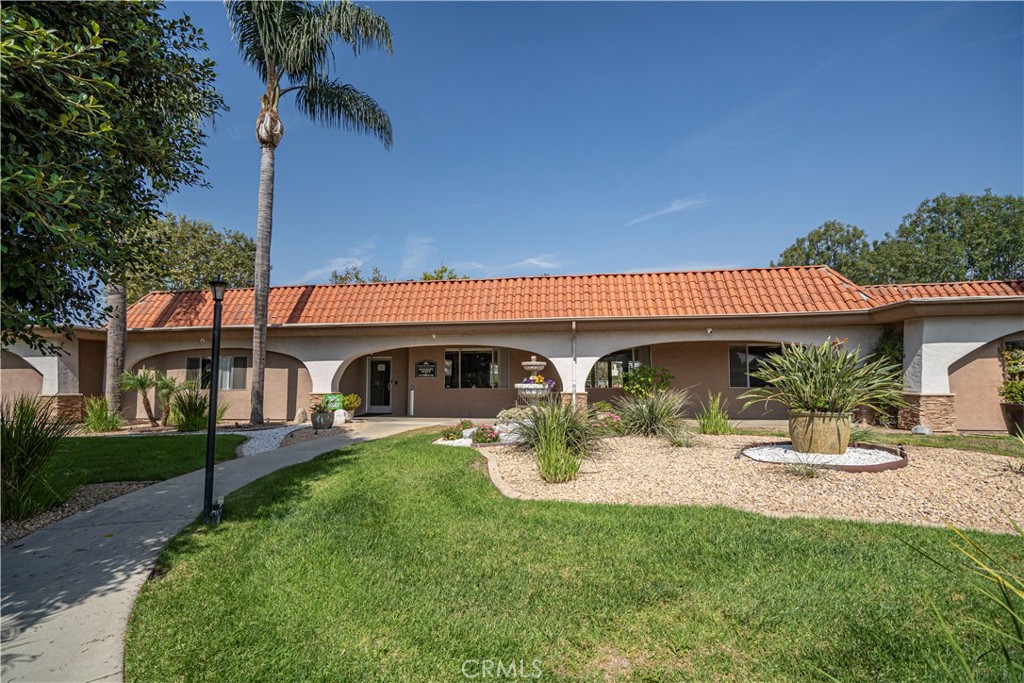 1001 West Lambert Road, Unit 153 La Habra, CA 90631 - Photo 14 of 28 front view of a house with a yard