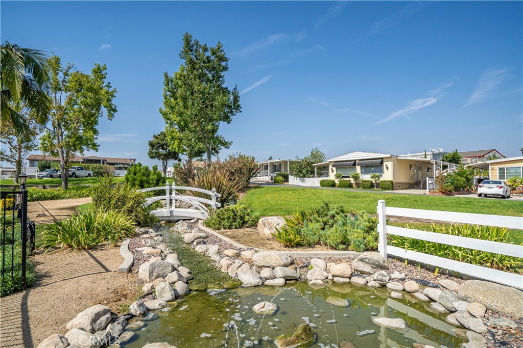 1001 West Lambert Road, Unit 153 La Habra, CA 90631 - Photo 14 of 24 a view of a garden with a building in the background
