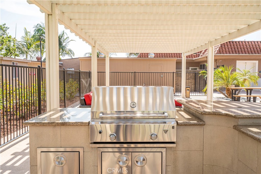 1001 West Lambert Road, Unit 153 La Habra, CA 90631 - Photo 20 of 28 a kitchen view with a sink and dishwasher a stove next to a window