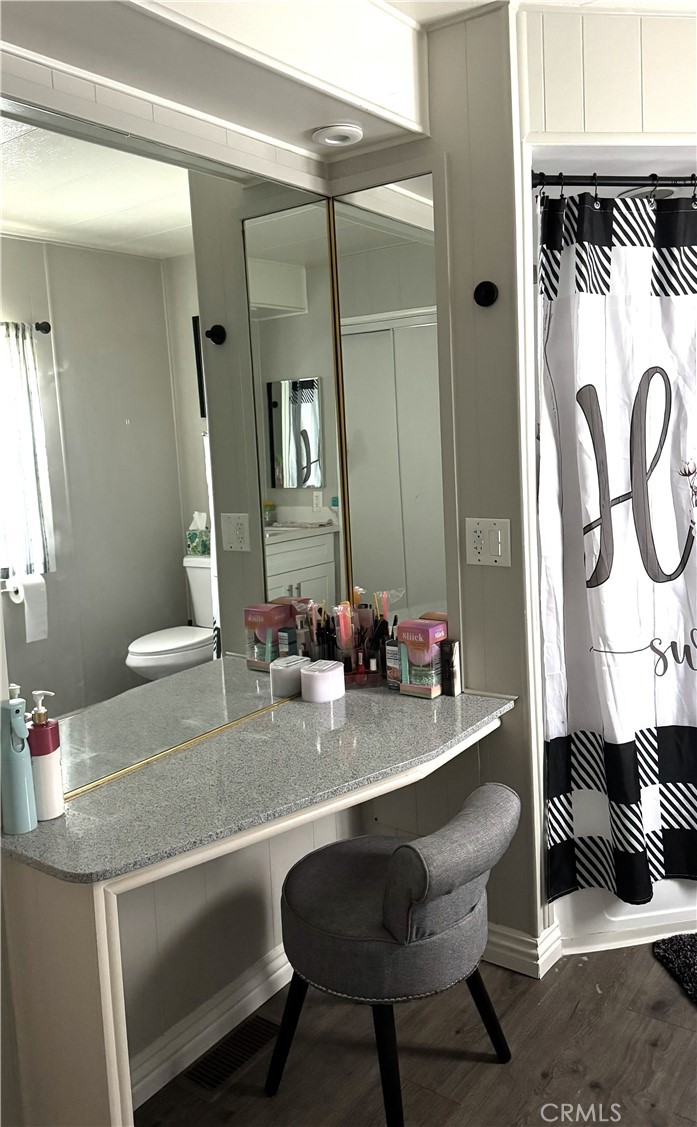 1001 West Lambert Road, Unit 153 La Habra, CA 90631 - Photo 8 of 28 a bathroom with a sink and a mirror