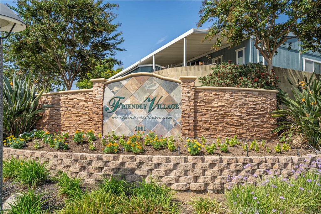 1001 West Lambert Road, Unit 153 La Habra, CA 90631 - Photo 9 of 24 front view of a house with a street